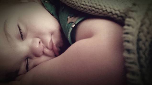 I run my fingers through his absurdly soft, brown hair. It radiates with a touch golden shine and I'm reminded of his eyes. I would say they have the same beautiful attributes. His hands still look like those of a newborn; pudgy, with a dimple atop each knuckle. One hand is slightly nudged under his sweet little rounded face, causing his cheeks to smush upward and together while giving a small pucker to his lips.